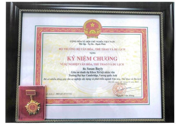 Certificate and medal from Vietnamese Government